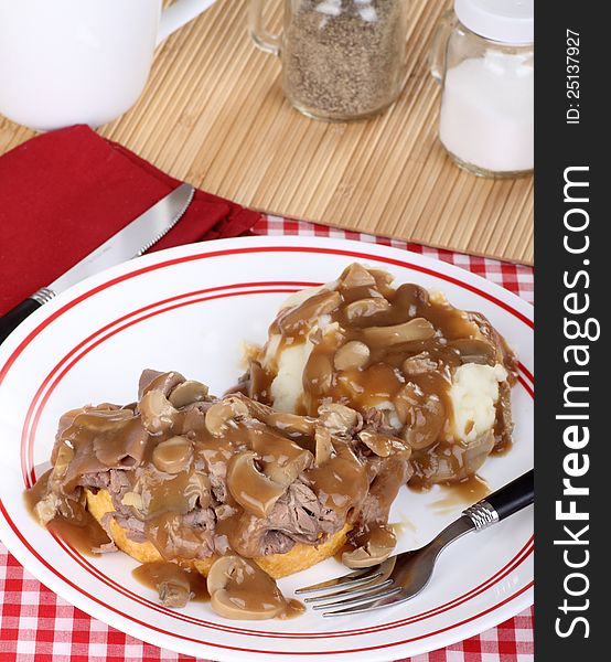 Roast beef sandwich with mash potatoes and mushroom gravy