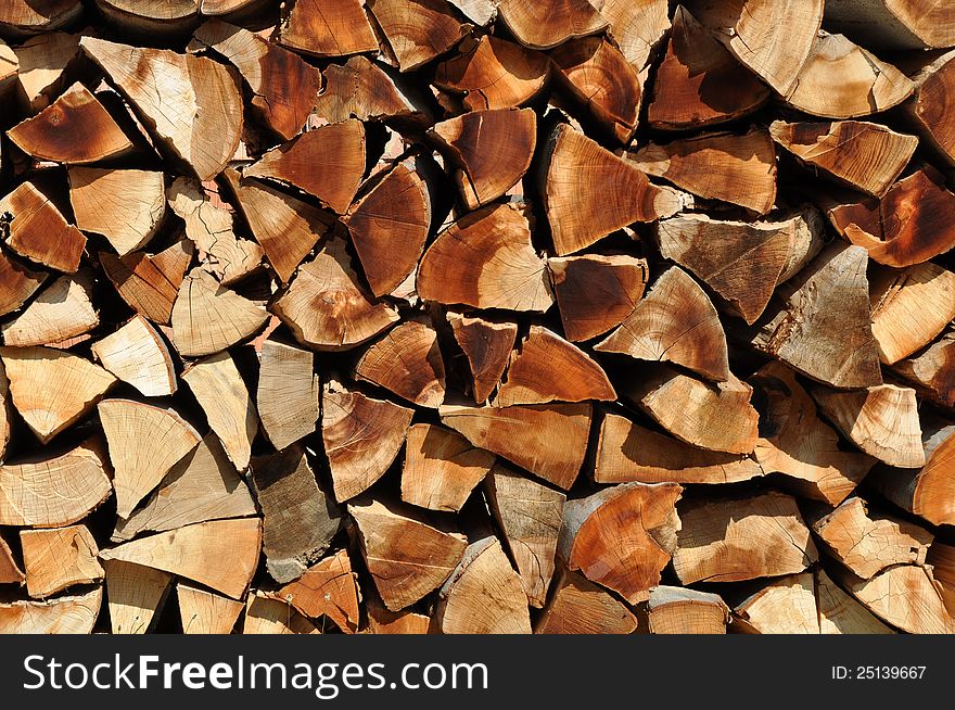Cut branches at a wood exploitation and stored on a mountain valley. Cut branches at a wood exploitation and stored on a mountain valley