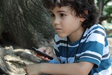 Curly Boy With Cellphone Stock Photo Curly Boy With Cellphone Stock Photo