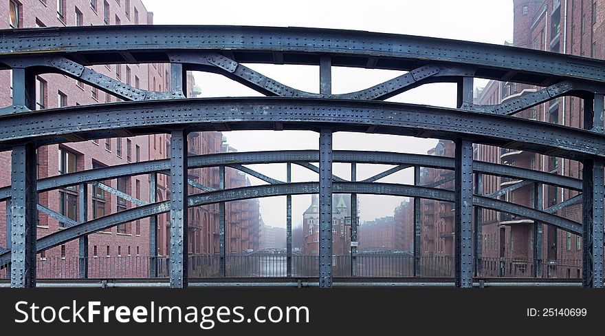 The old historical Speicherstadt Hamburg, Germany, with a bridge over the river elbe canal (Fleet).