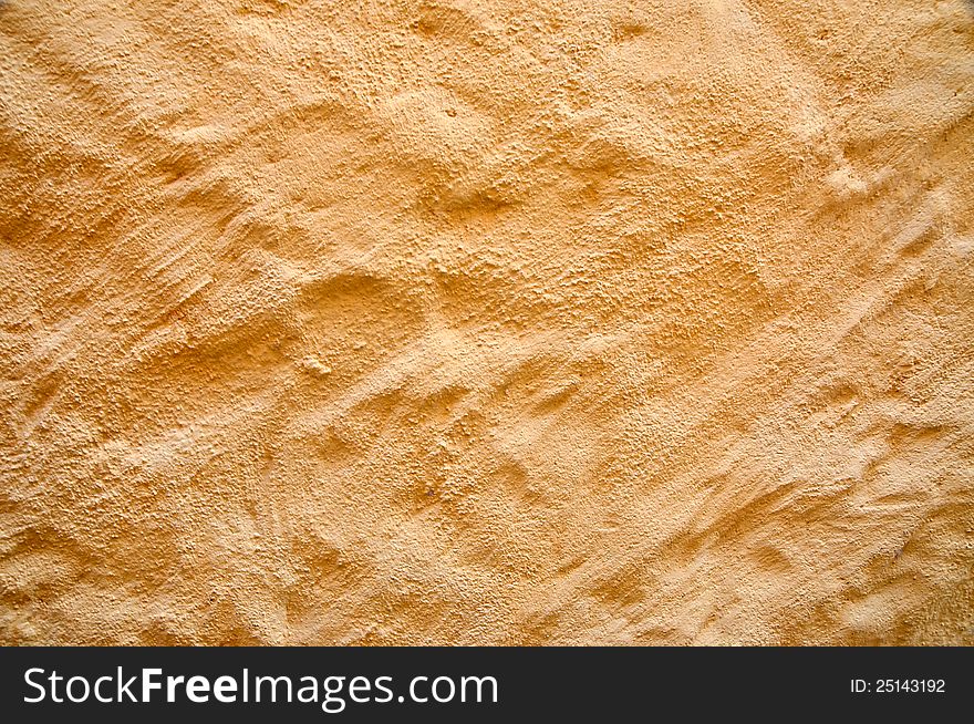 Yellow textured wall background pattern