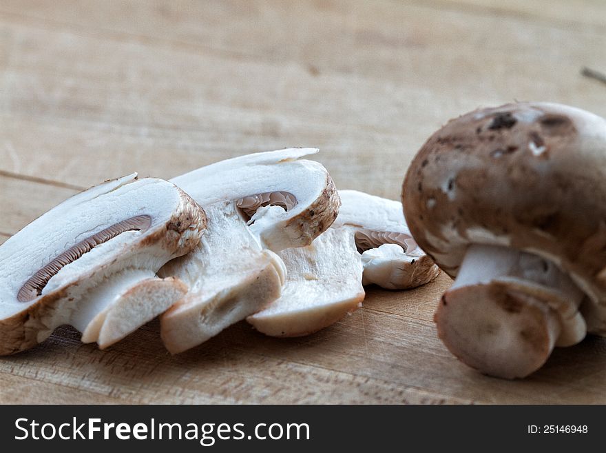Sliced and whole baby bella mushrooms. Sliced and whole baby bella mushrooms