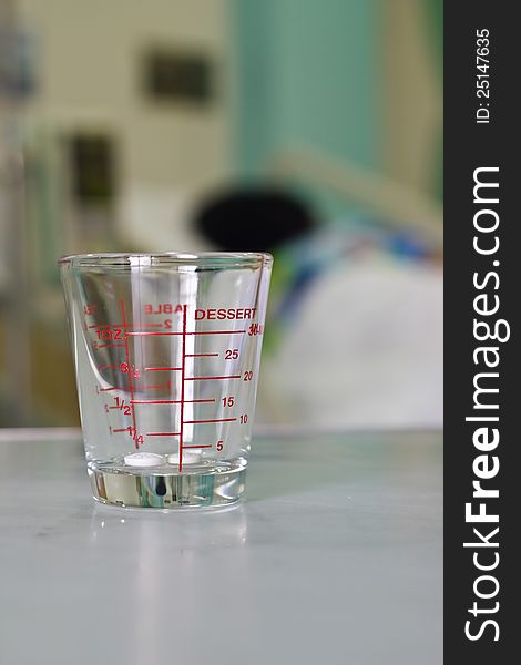 Dosage cup with measurements displayed