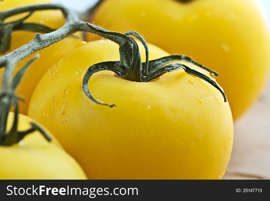 Ripe yellow tomatos close-up