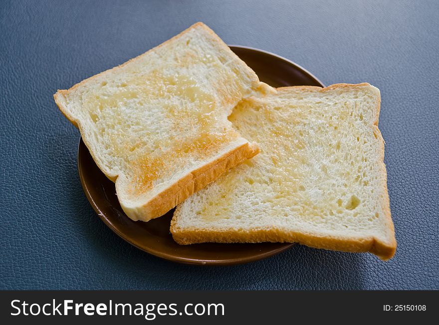 Two slice bread on dish for breakfast
