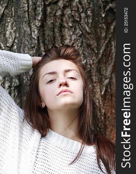 Portrait of beauty teenage girl on tree bark background. Portrait of beauty teenage girl on tree bark background