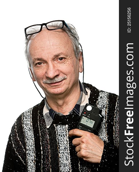 Portrait of a senior photographer with a flash meter and glasses