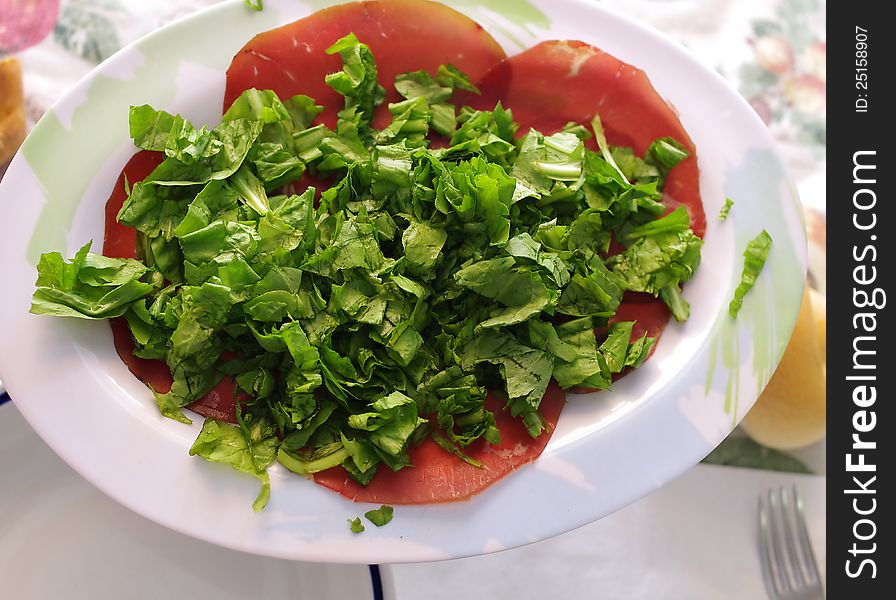 Italian bresaola and green chicory