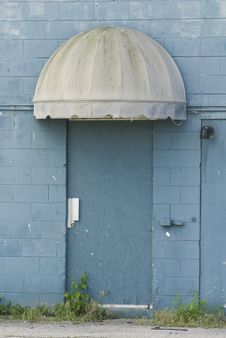 Blue Door Under An Old Canopy Royalty Free Stock Images