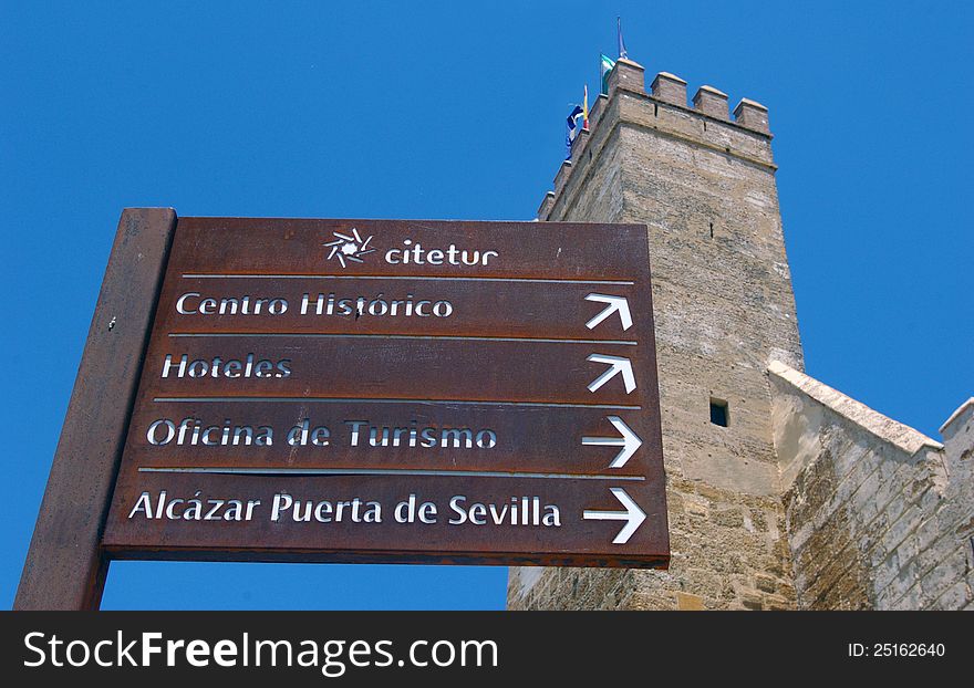 Direction road signs to famous landmarks and tourist sites in Seville, Spain. Direction road signs to famous landmarks and tourist sites in Seville, Spain.