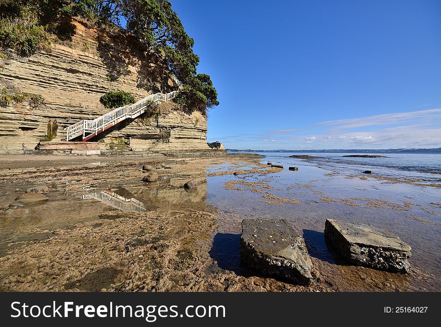 Steps on the coastline leading down to the beach and rocks. Steps on the coastline leading down to the beach and rocks.