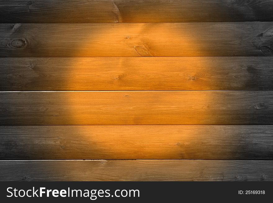 A natural wood background with a spotlight. A natural wood background with a spotlight