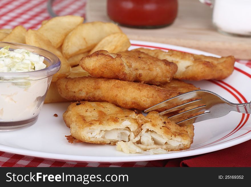 Battered fish fillet meal with french fries. Battered fish fillet meal with french fries