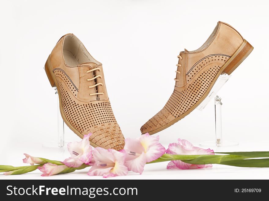 Men shoes with rose on white background