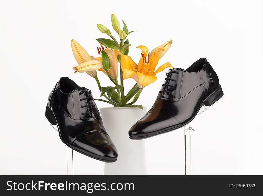 Men shoes with rose on white background