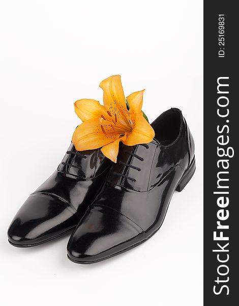 Men shoes with flower on white background