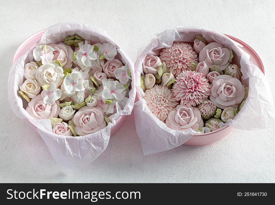homemade marshmallows in a gift box on a light background, a beautiful delicate bouquet of marshmallow flowers, holiday concept, gifts