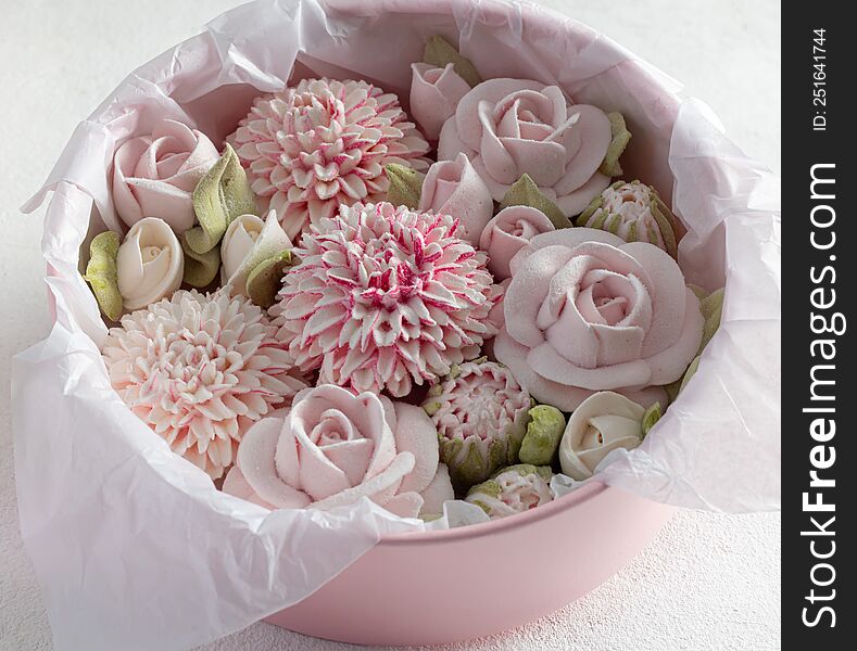 homemade marshmallows in a gift box on a light background, a beautiful delicate bouquet of marshmallow flowers, holiday concept, g