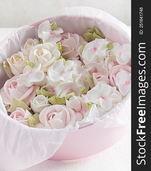 homemade marshmallows in a gift box on a light background, a beautiful delicate bouquet of marshmallow flowers, holiday concept, g