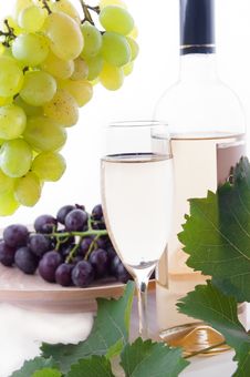 White Wine Bottle, Glass And Cask With Grapes Stock Images White Wine Bottle, Glass And Cask With Grapes Stock Images