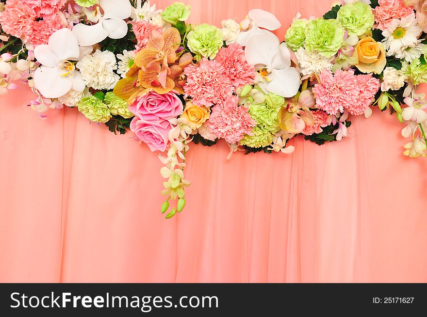 Beautiful flowers blossom on pink curtain background for wedding scene