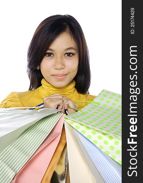 Shopping woman hold bags isolated over white background