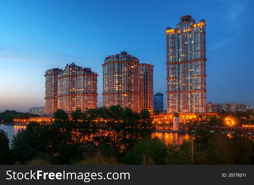 Inhabited skyscrapers at night in Moscow