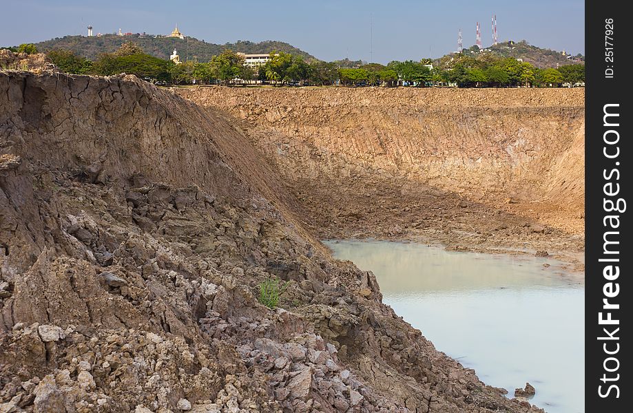 Soil Avalanche Of The Pond.