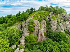 Rocky Hill With Abundant Vegetation. Cedars Grow Right In The Rocky Rock. Nature Protection Zone Near Khabarovsk In The Khekhtsir Stock Photo
