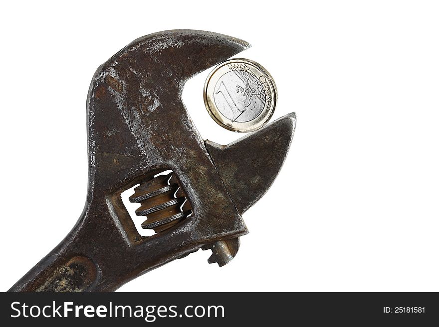 Old rusty adjustable wrench with one euro coin on white background. Clipping path is included. Old rusty adjustable wrench with one euro coin on white background. Clipping path is included
