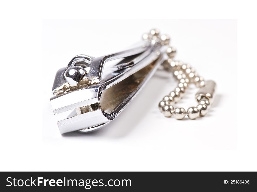 Nail scissors on white background with shallow focus