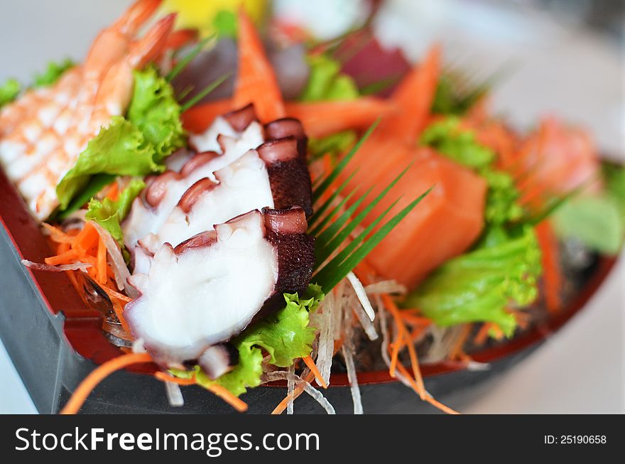 Sashimi seafood set in a boat blow - Japanese style food