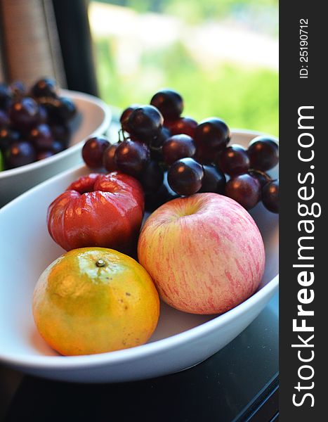 Variety of Fresh Fruits in white bowl