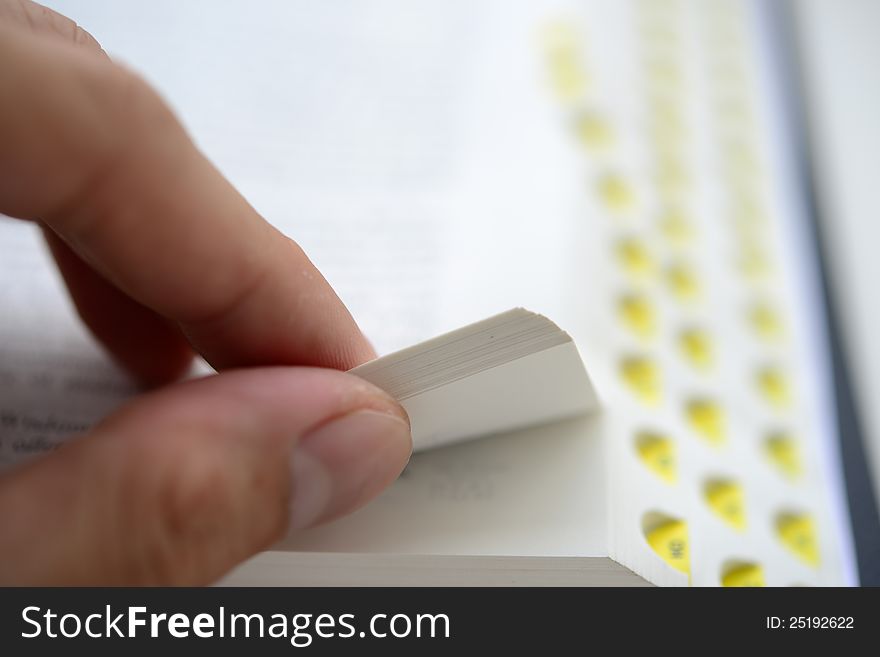 Hand Flipping The Bible With Shallow DOF