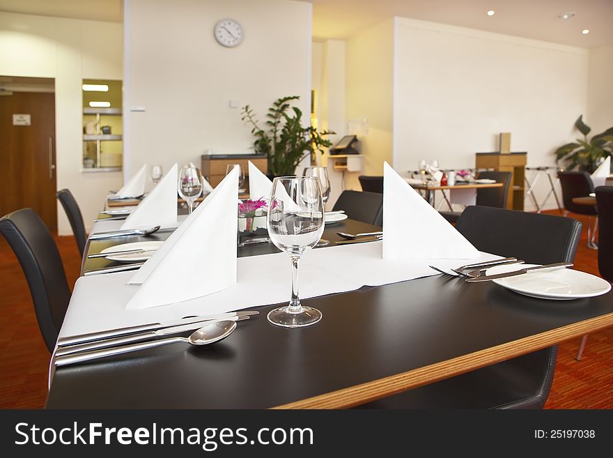 Tables with formal setup in modern restaurant.. Indoors
