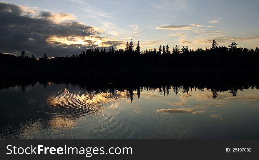 Landscape with sunset forest and lake