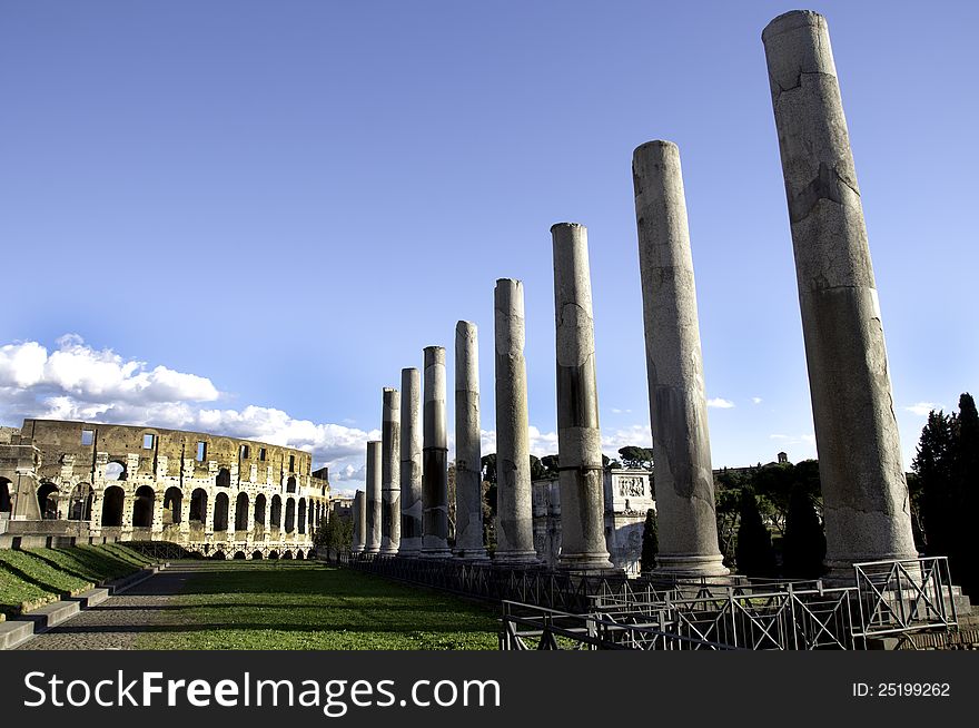 Photo taken from the Antiquarium Forense along the Roman Pillars towards the Colosseum. Photo taken from the Antiquarium Forense along the Roman Pillars towards the Colosseum.