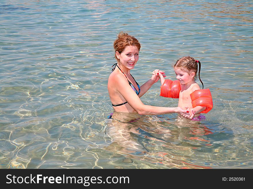 Mother with the daughter bathe