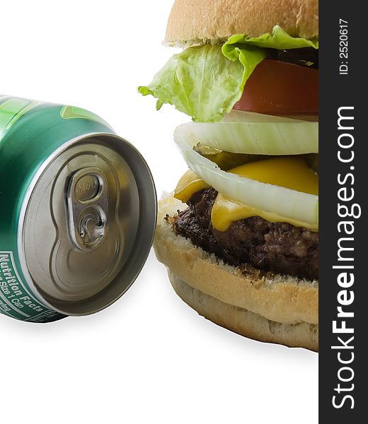 Cheeseburger and soda can isolated on white