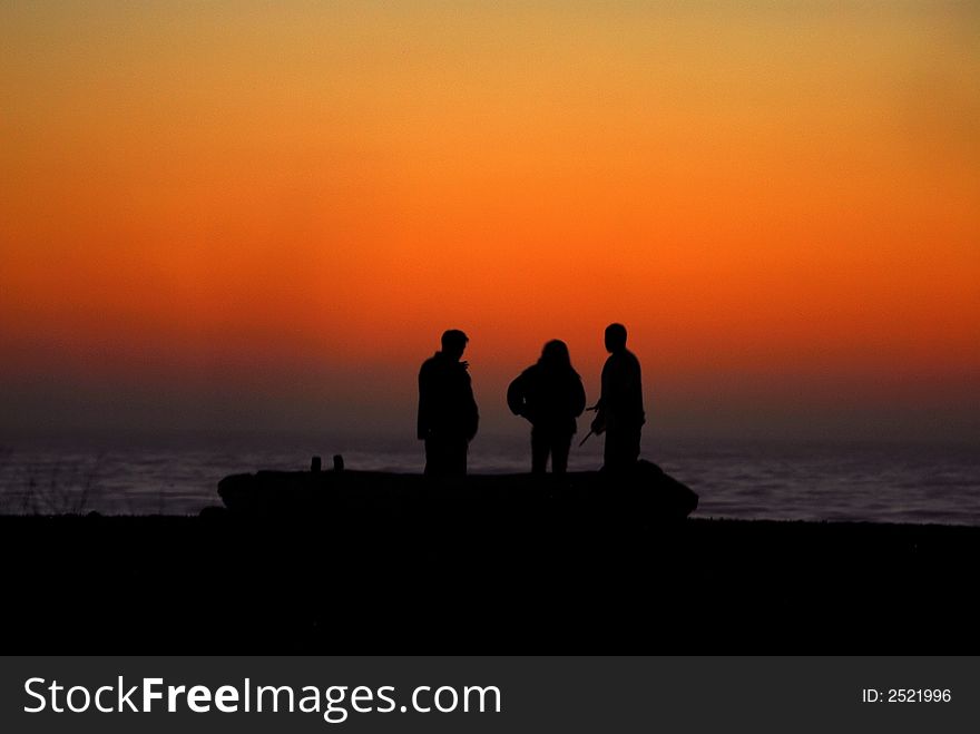 Pacific ocean Sunset, kids enjoying the sun setting over the horizon. Pacific ocean Sunset, kids enjoying the sun setting over the horizon.