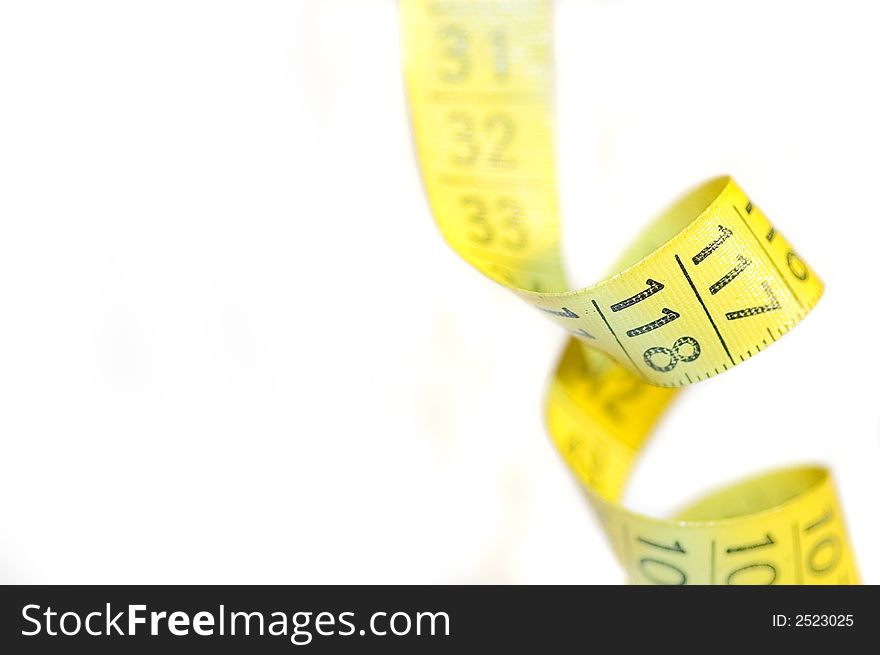 A yellow centimeter measure on white background