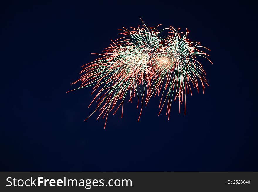 Firework on a background of the dark sky