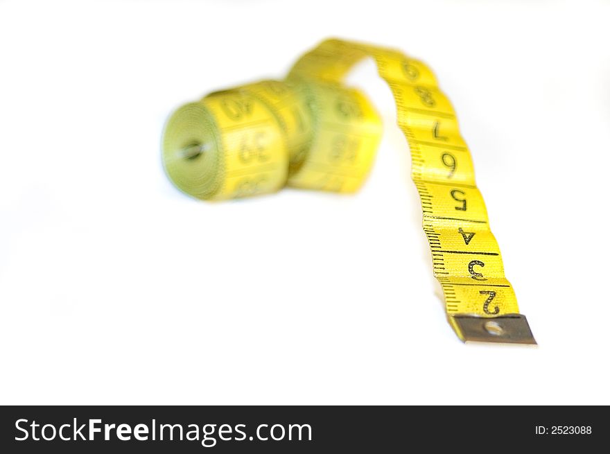 A yellow centimeter measure on white background