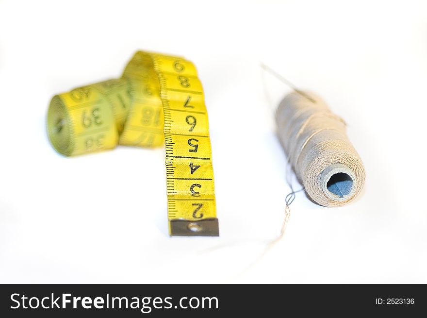 A yellow centimeter measure on white background