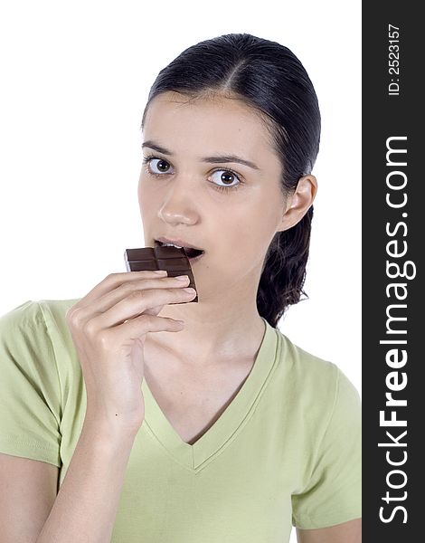 pretty girl eating chocolate isolated. pretty girl eating chocolate isolated