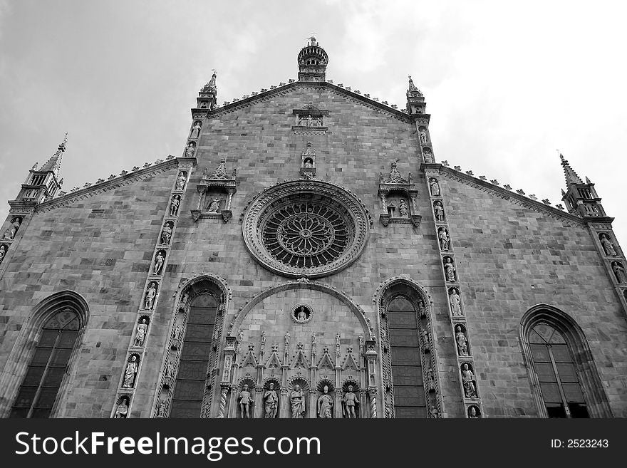 Photograph of the facade of the marble cathedral of the town of Como in Italie. Photograph of the facade of the marble cathedral of the town of Como in Italie.