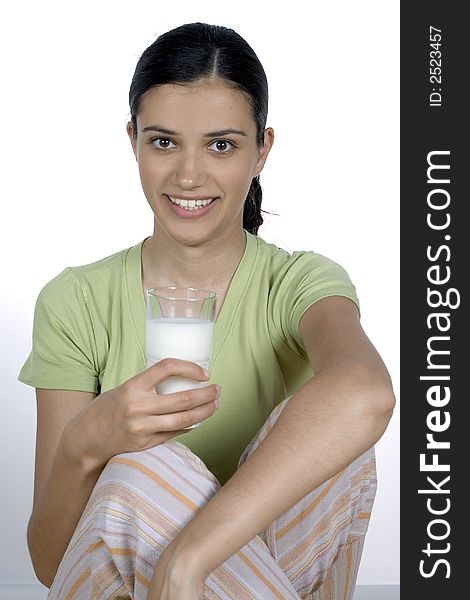Girl holding glass with milk. Girl holding glass with milk