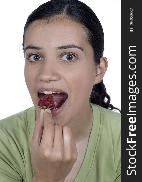 Pretty girl eating strawberry isolated
