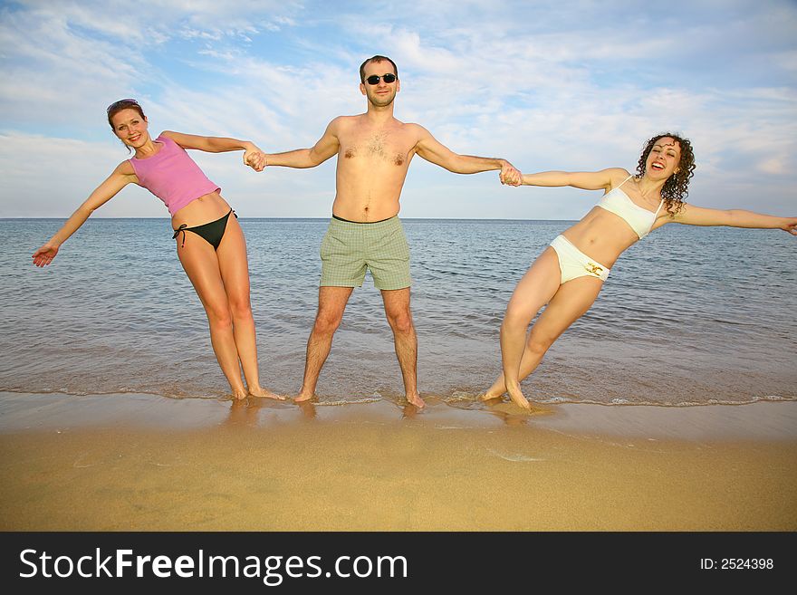 Man and girls about the sea