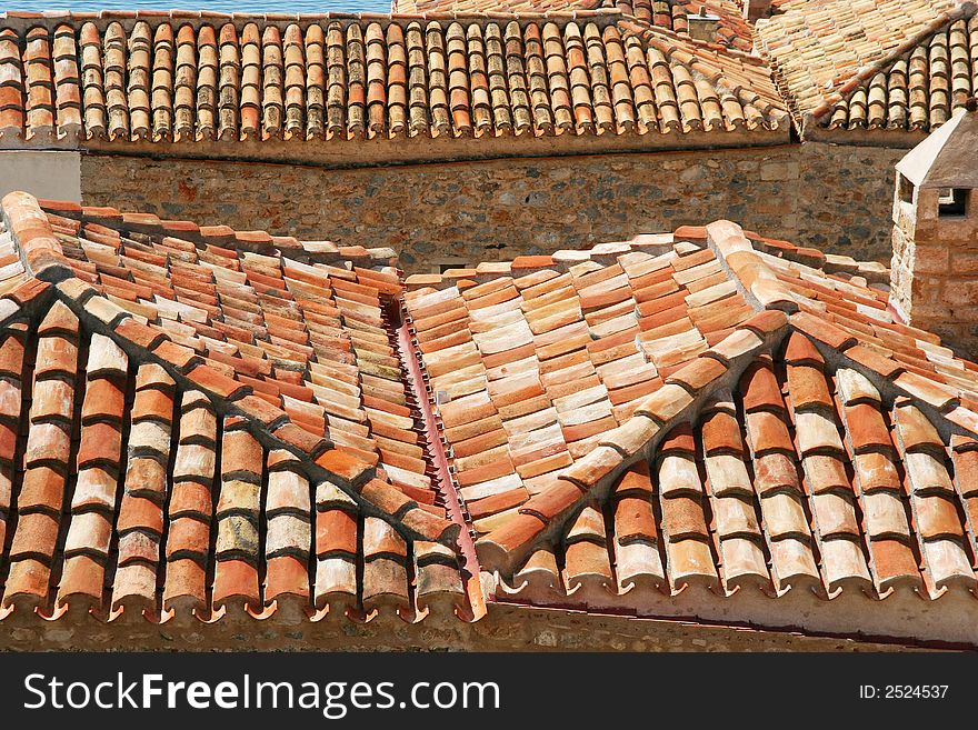 A number of houses with tiled roofs, seen from above (Monemvasia, Greece)